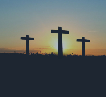 Three Crosses in Field